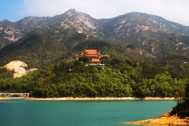 Jintai Temple in Doumen District of Zhuhai, Guangdong, China. A general view from the special viewing spot across the lake.